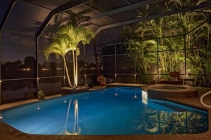 Picture of hardscape decking around pool with outdoor lighting